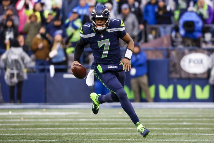 Jan 8, 2023; Seattle, Washington, USA; Seattle Seahawks quarterback Geno Smith (7) scrambles against the Los Angeles Rams during the fourth quarter at Lumen Field.